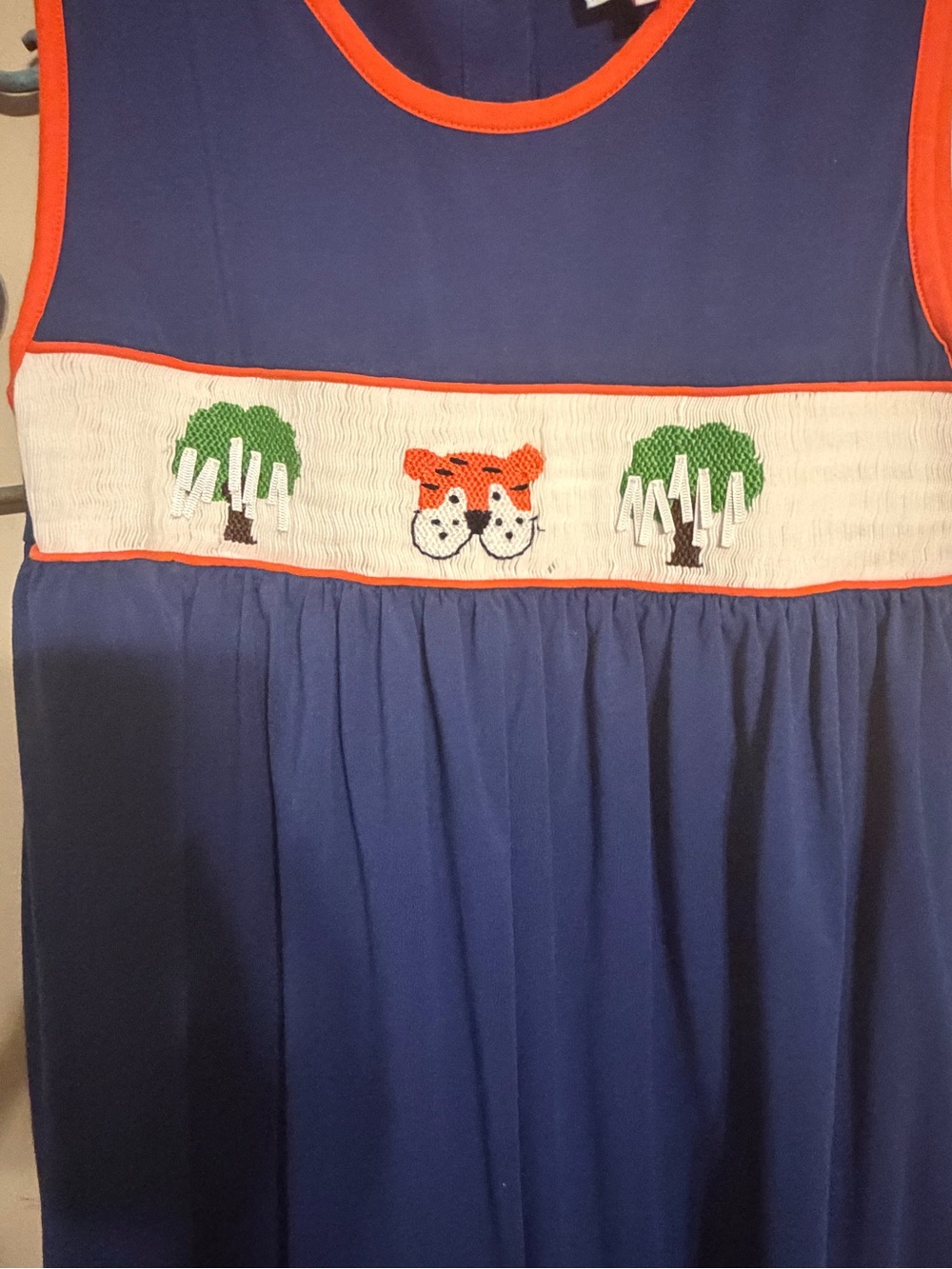 Sugar Navy Sleeveless Smocked Dress with Orange Trim and Tiger Embroidery - Picture 4 of 5